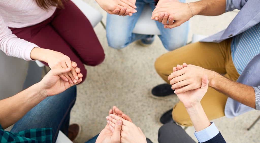 support group helping each other stay sober during rehab
